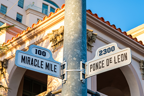 This is a stock photo from Shutterstock. This photo is an up close view of a street sign in Coral Gables, FL. The street sign is located on a famous street called Miracle Mile.